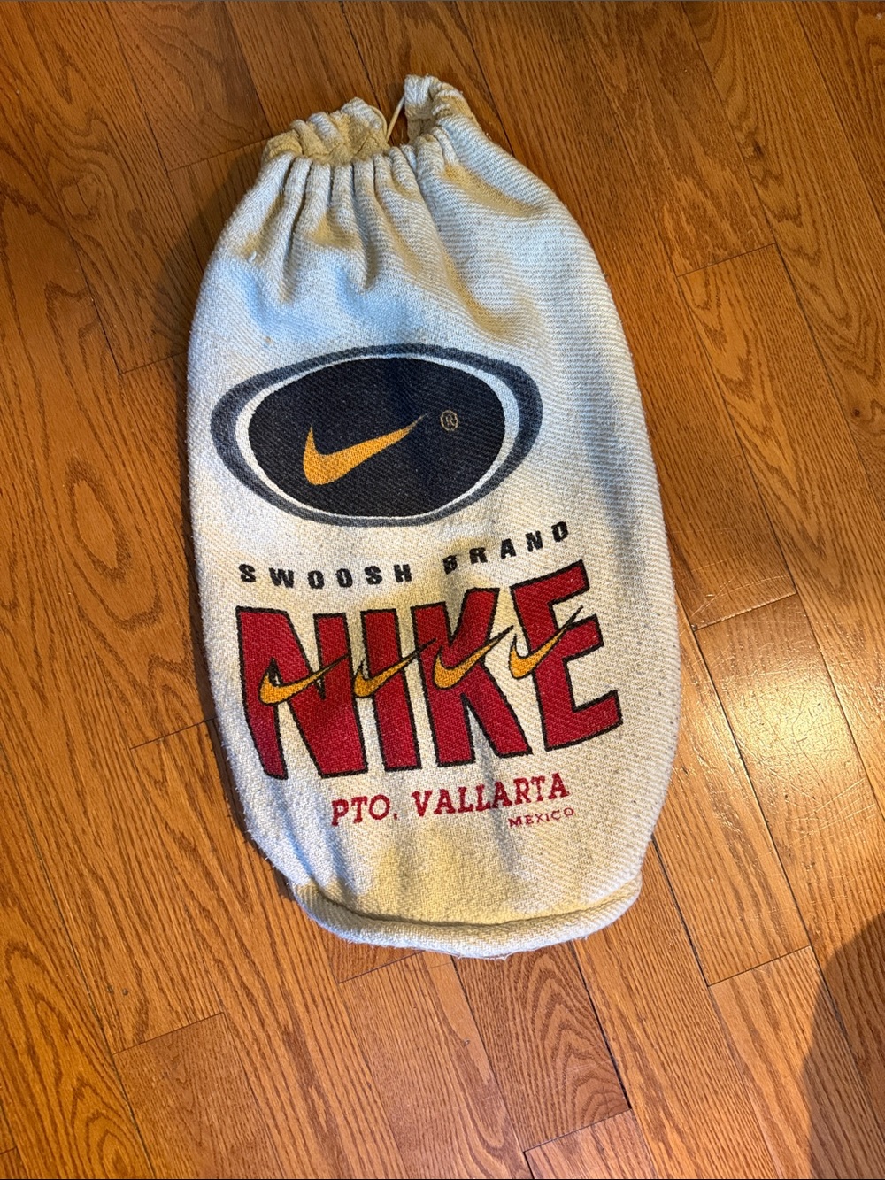Nike Cream Bag with Red Logo and Yellow Swoosh
